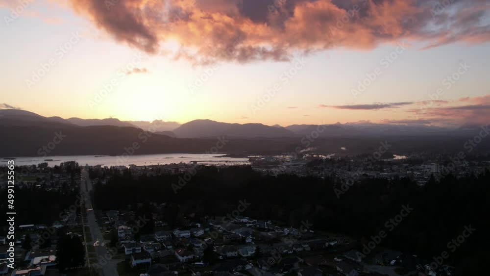 Aerial Rotating Golden Clouds Sunset Time Lapse of a Small City or Town, Port Alberni, British Columbia, Canada Aerial Rotating Golden Clouds Sunset Time Lapse of a Small City or Town, Port Alberni, British Columbia, Canada