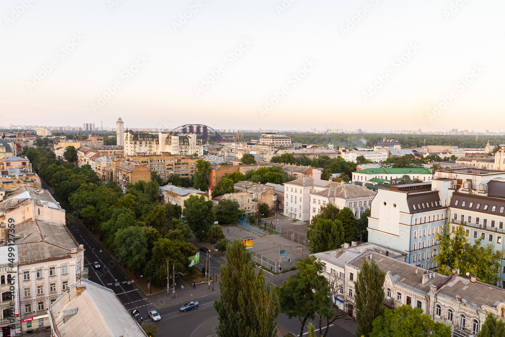 Ukraine, Kyiv – July 04, 2015: Aerial panoramic view on central and historical part, area of city Podil with residential buildings in the evening, during the sunset. Pre-revolutionary buildings