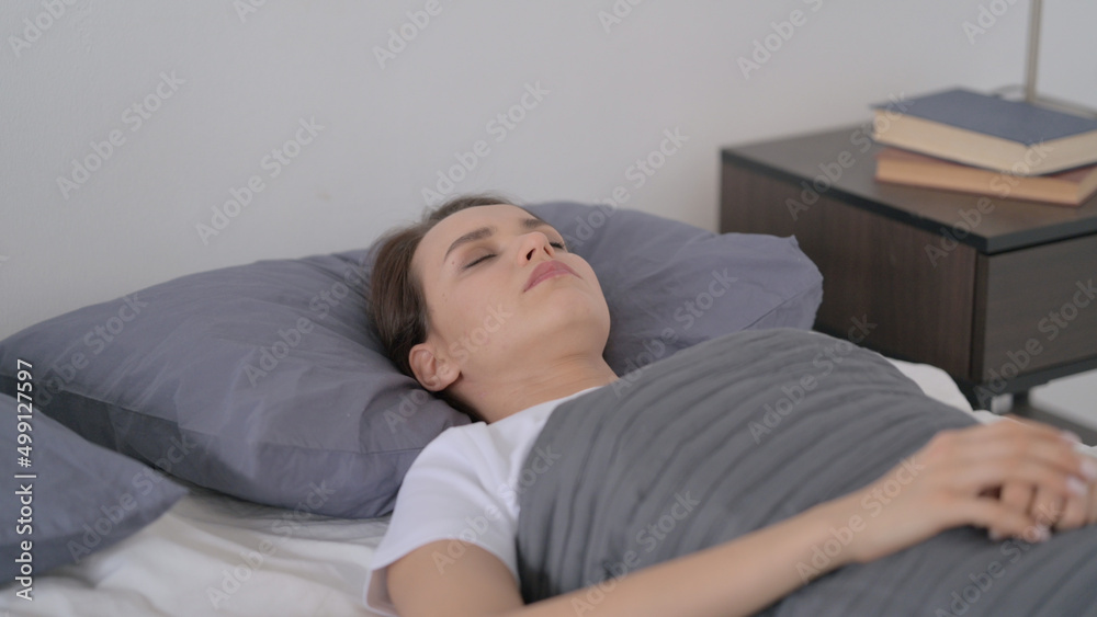 Woman Feeling Uncomfortable while Sleeping in Bed