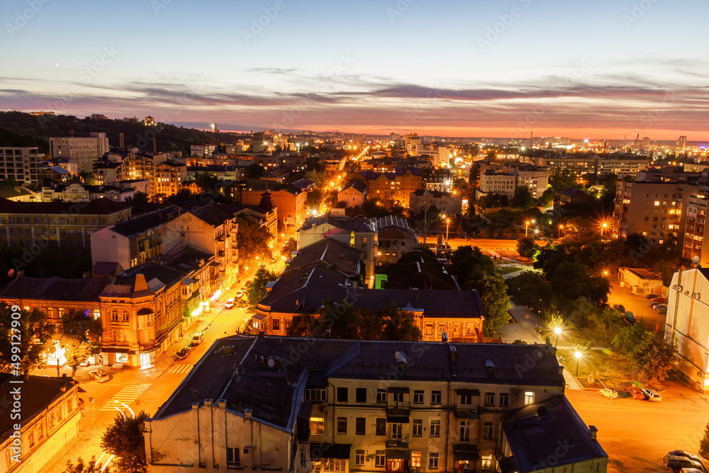 Ukraine, Kyiv – July 04, 2015: Aerial panoramic view on central and historical part, area of city Podil with residential buildings in the evening, during the sunset. Pre-revolutionary buildings