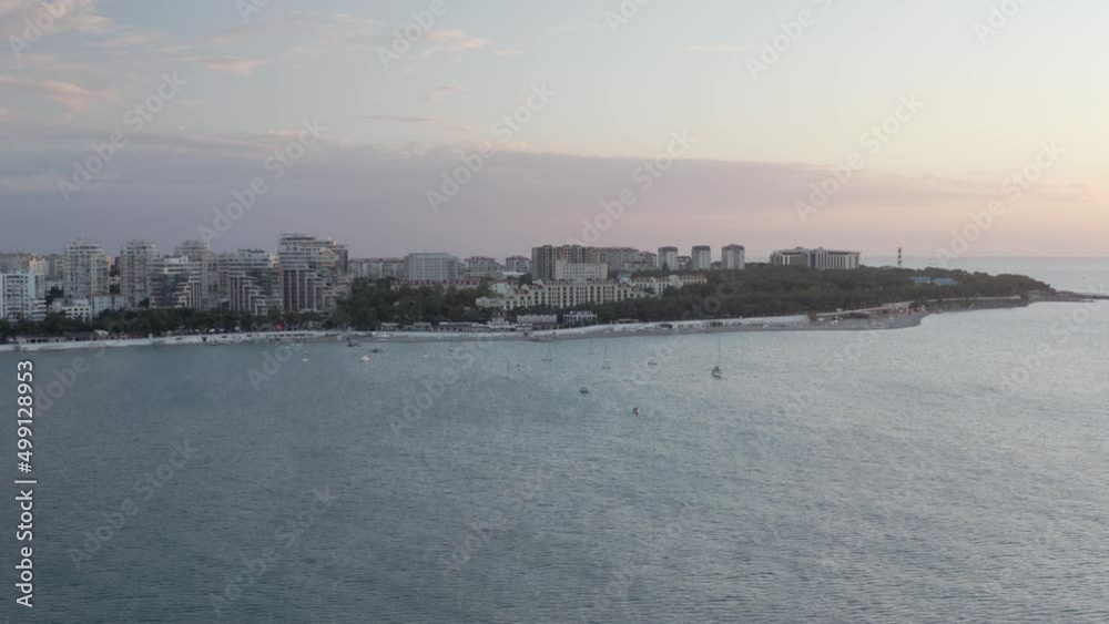 Sunrise touristic city sea harbor water transport yacht regatta bay. Shooting from drone gorgeous nature seascape ship boat admiring the sunset sun horizon. Aerial view natural tracking shot in 4k Sunrise touristic city sea harbor water transport yacht regatta bay. Shooting from drone gorgeous nature seascape ship boat admiring the sunset sun horizon. Aerial view natural tracking shot in 4k