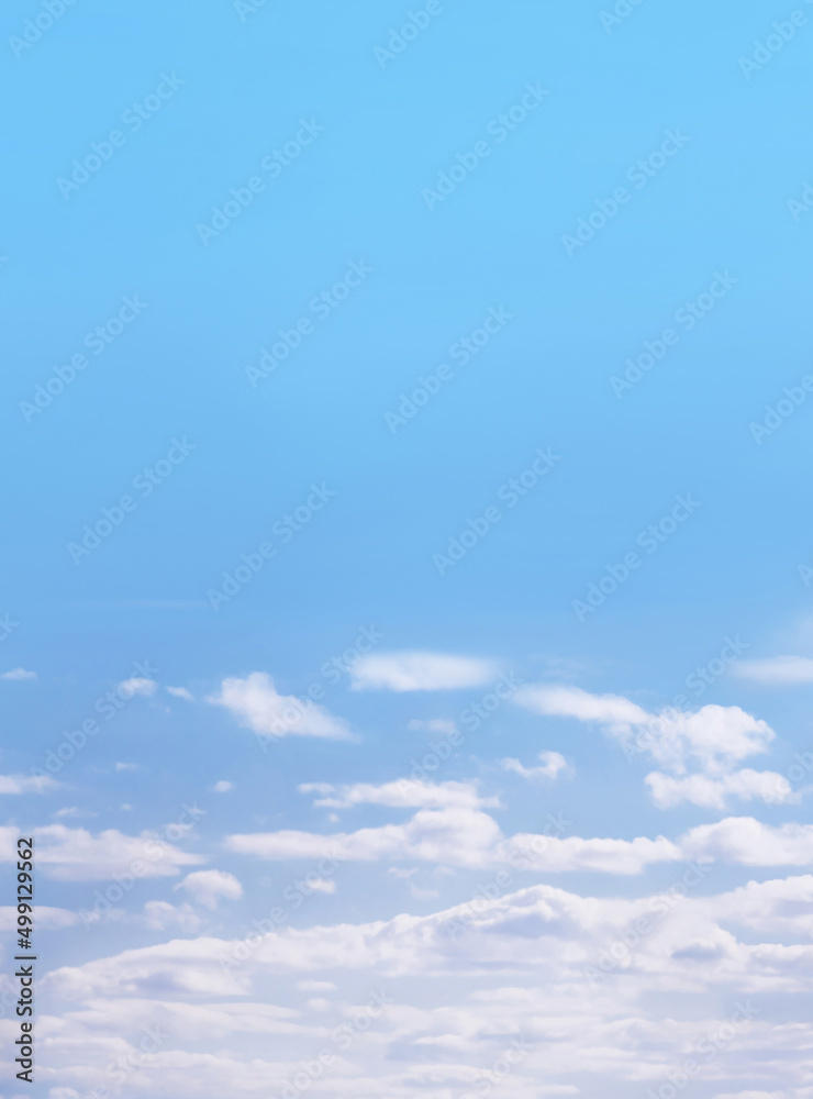 Blue sky with white fluffy cirrus clouds, soft focus. Heavenly clouds background summer. Concept of freedom, relaxation, ecology. Copy space. Empty space.