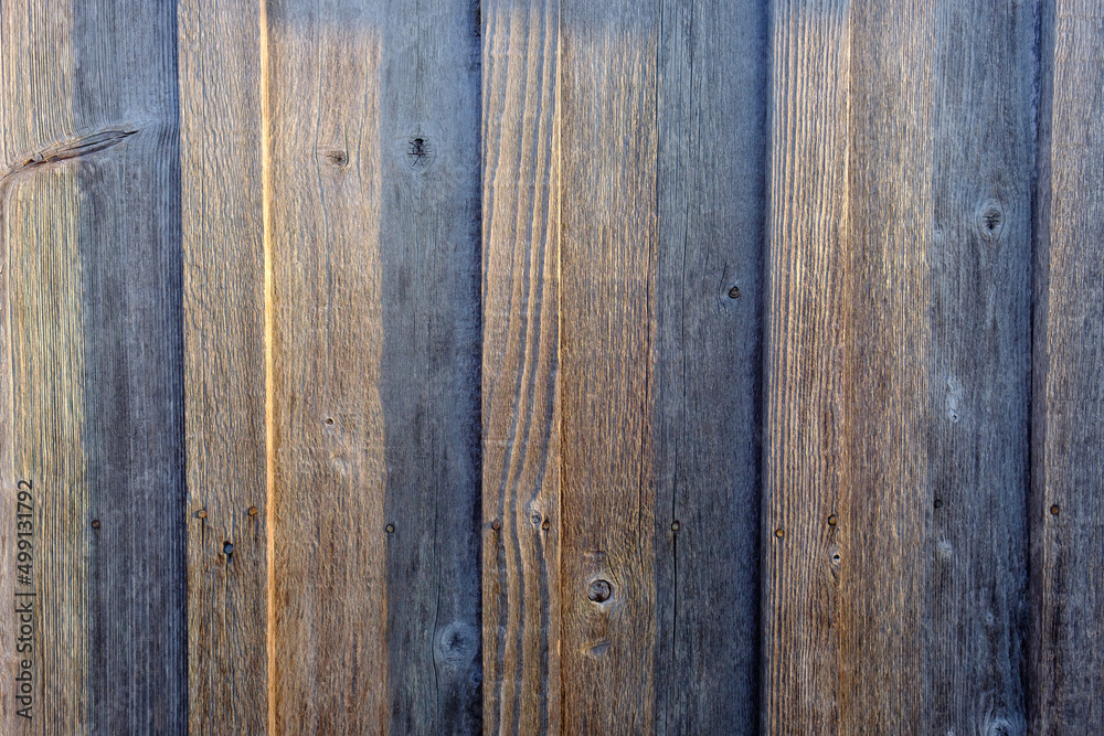 Fototapeta premium Graphic image of sunset light striking a restored old wooden building side in Roanoke North carolina