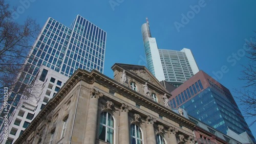 Historical old building of Frankfurt am main with commerzbank tower and skyscrapers in the financial district on a sunny day with blue sky photo