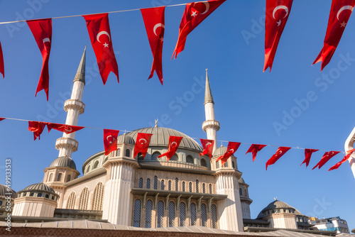 Waving Turkish flags against Taksim Mosque Istanbul Turkey photo