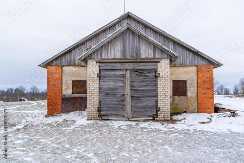 Old Wooden Shed Doors Exterior on White Brick Wall