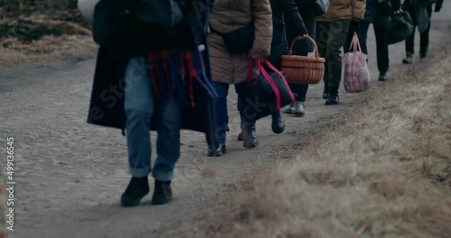 Refugees Walking On Road While Migrating During War.
