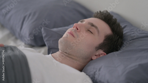 Man Waking up from Sleep in Bed, Close up