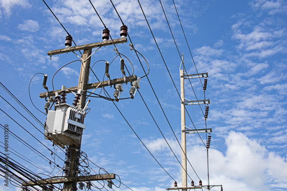 Electric poles and transformers on a clear day Electric poles and transformers on a clear day