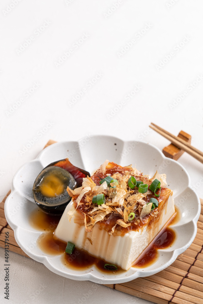 Delicious Chilled tofu and century egg with soy sauce and bonito flakes. Delicious Chilled tofu and century egg with soy sauce and bonito flakes.