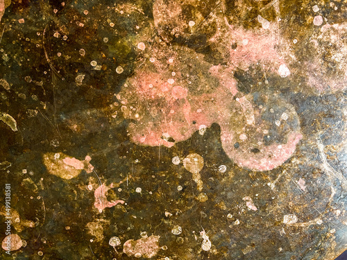 Stained and eroded metal table top