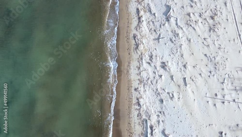 Buttery soft aerial view flight bird's eye view drone footage of the coastline and waves at
natural sand Bouka Beach at Corfu Greece is a travel paradis 4k Cinematic view from above by Philipp Marnitz photo