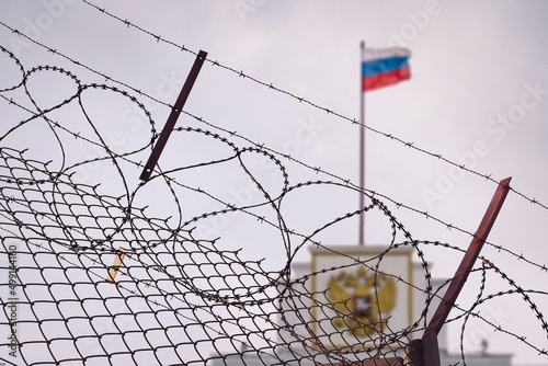concept of European and US sanctions pressure on the Russian Federation government. flag of the Russian Federation in barbed wire, sanctions and aggression of Russia. Russian prison