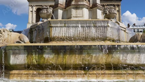 Pan over Fountain Saint-Sulpice on a sunny day - Paris, France