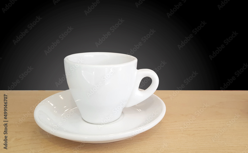 White cup on wood table White cup on wood table