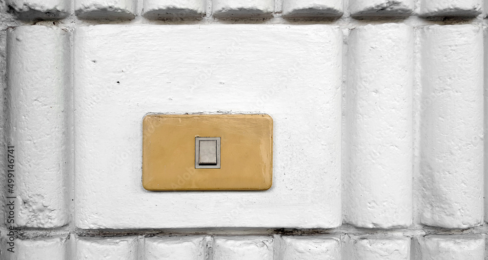 light switch  in the white brick wall