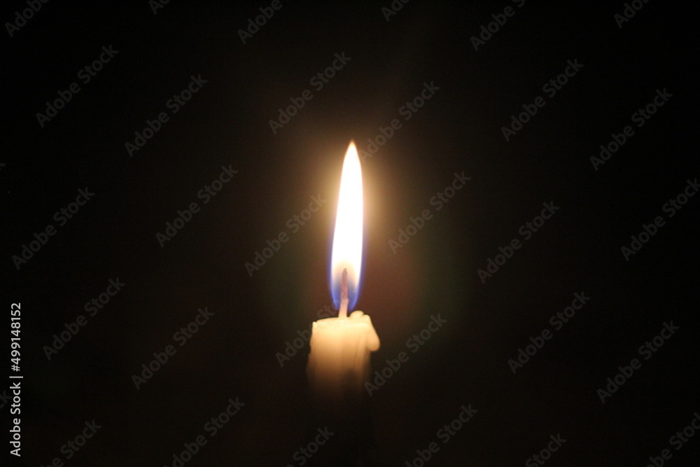 Candle light burning in the darkness Candle light burning in the darkness