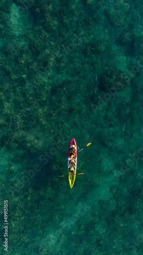 Top view of canoe. people boating in the sea.