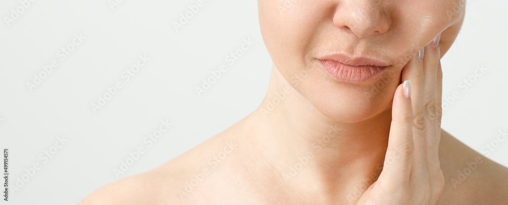 A Woman Suffering From Strong Teeth Pain, Touching Cheek With Hand. Dentistry Concept. A Woman Suffering From Strong Teeth Pain, Touching Cheek With Hand. Dentistry Concept.