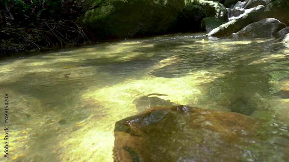small mountain waterfall that cascades down rocks and rocks with water splashing down tropical nature forest national park thailand small mountain waterfall that cascades down rocks and rocks with water splashing down tropical nature forest national park thailand