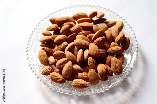 Almond on a plate,health benefits,highly nutrious,vitamins,minerals and antioxidants photo