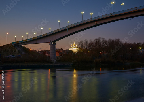 bridge over river and St.Catherine`s church at night in Chernihiv, Ukraine