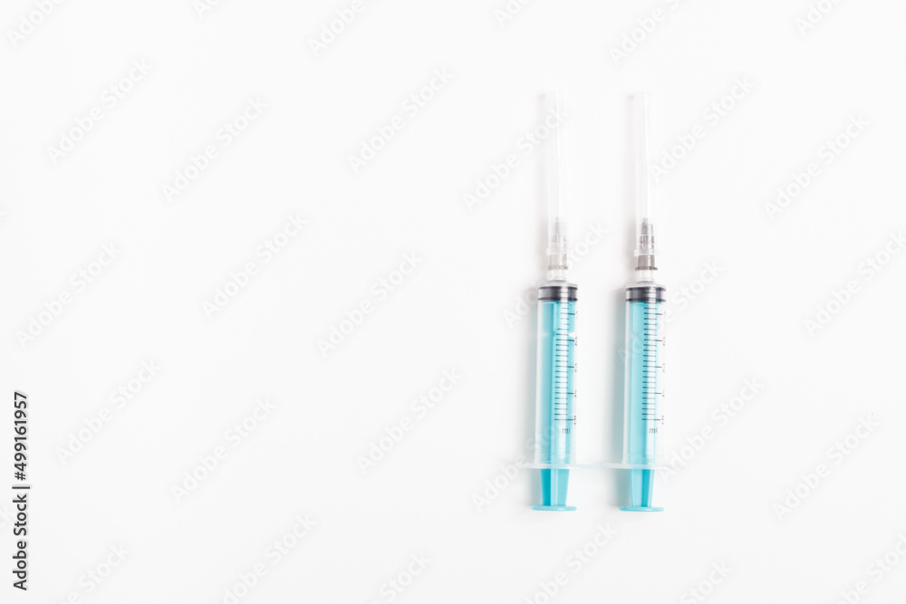 Medical syringe on a white background. A syringe for injection. The concept of health and beauty