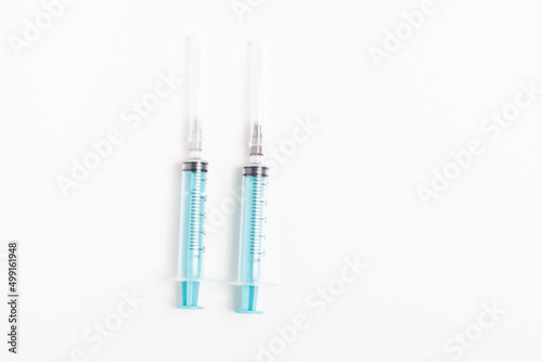 Medical syringe on a white background. A syringe for injection. The concept of health and beauty