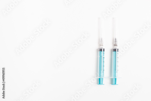 Medical syringe on a white background. A syringe for injection. The concept of health and beauty