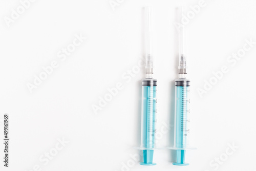 Medical syringe on a white background. A syringe for injection. The concept of health and beauty