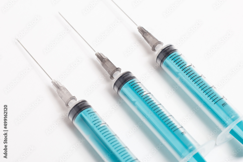 Medical syringe on a white background. A syringe for injection. The concept of health and beauty Medical syringe on a white background. A syringe for injection. The concept of health and beauty
