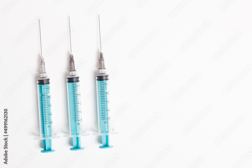 Medical syringe on a white background. A syringe for injection. The concept of health and beauty Medical syringe on a white background. A syringe for injection. The concept of health and beauty
