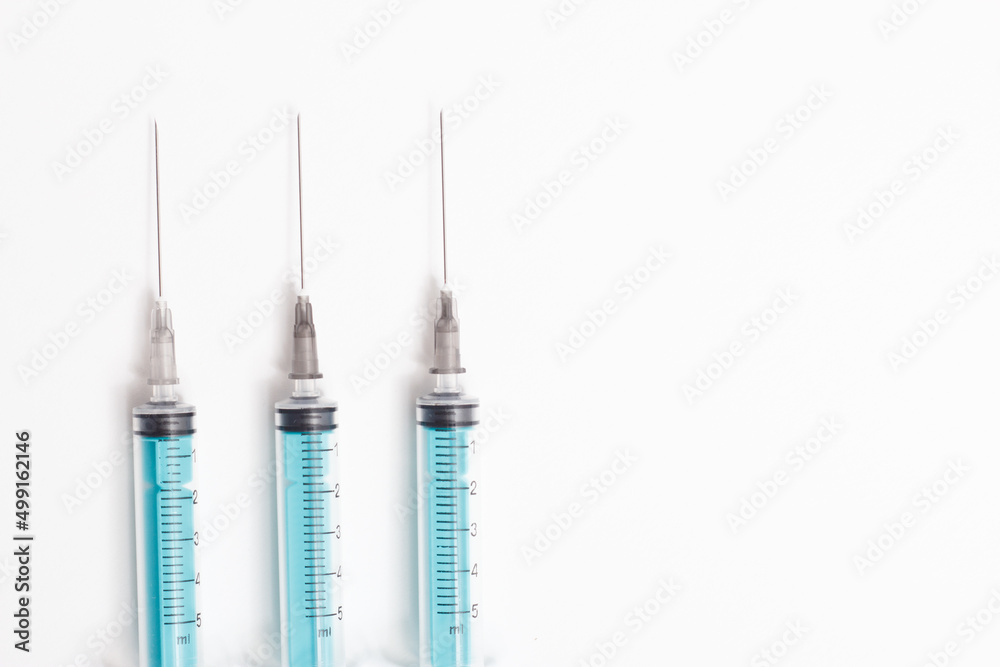 Medical syringe on a white background. A syringe for injection. The concept of health and beauty Medical syringe on a white background. A syringe for injection. The concept of health and beauty