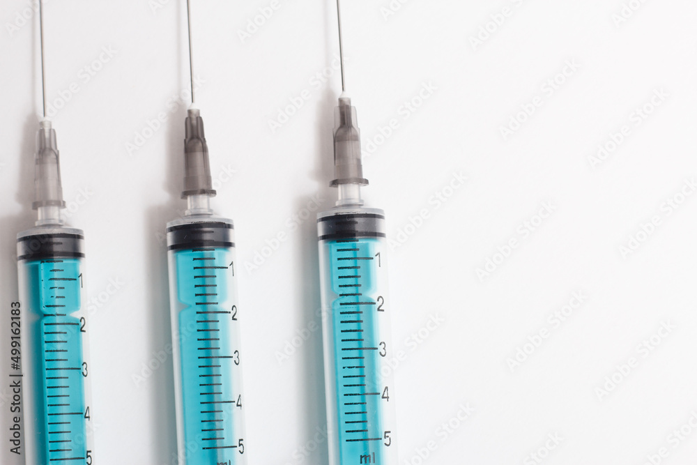 Medical syringe on a white background. A syringe for injection. The concept of health and beauty Medical syringe on a white background. A syringe for injection. The concept of health and beauty