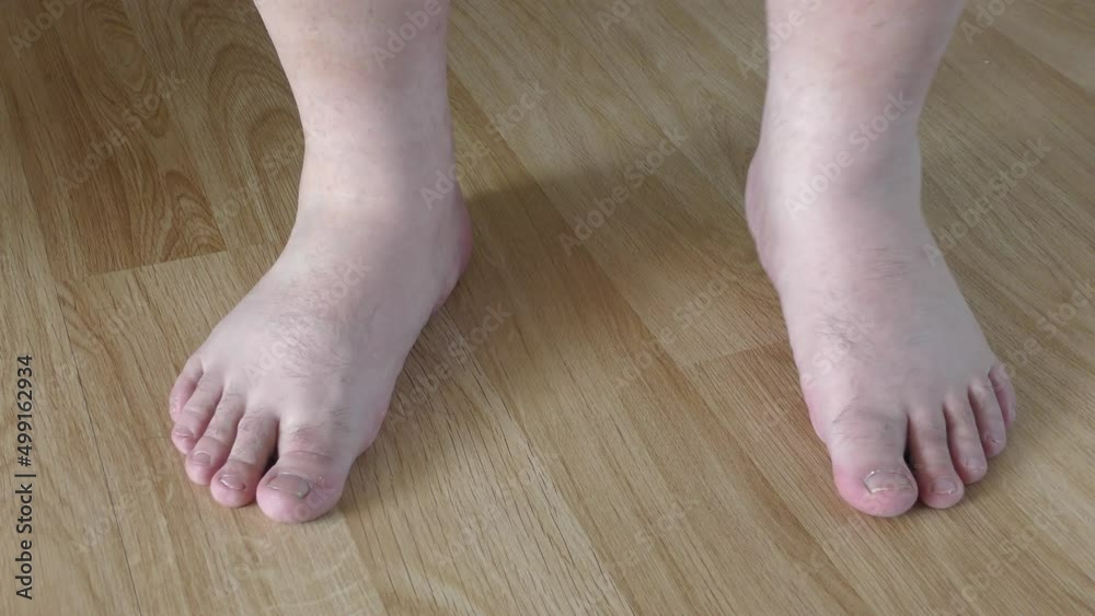 bare male legs on the floor close-up