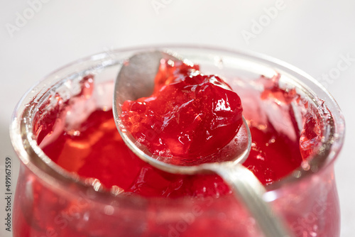 Raspberry jelly. Spoon of jelly photo