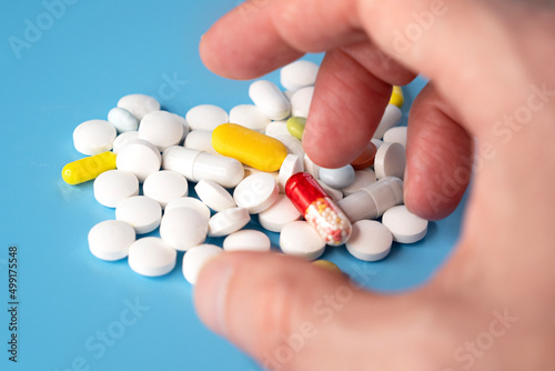 Person taking pills, drugs or pills addiction, concept picture