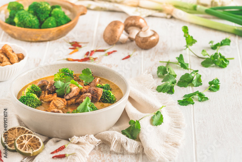 Vegan Tom Kha Gai soup with various vegetables and roasted soy-based meat substitutes