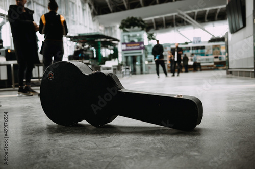 Guitar case on the airport floor