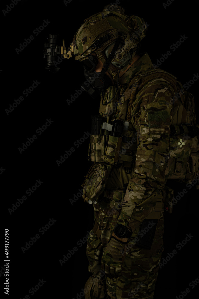 SOF special forces soldier wearing US made gear, crye precision, ops core. Studio portrait isolated on black background SOF special forces soldier wearing US made gear, crye precision, ops core. Studio portrait isolated on black background