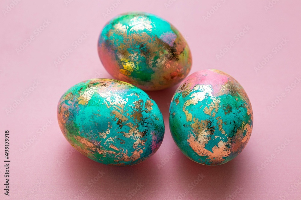 Easter colorful eggs on pink background. Easter card. Selective focus. Easter colorful eggs on pink background. Easter card. Selective focus.