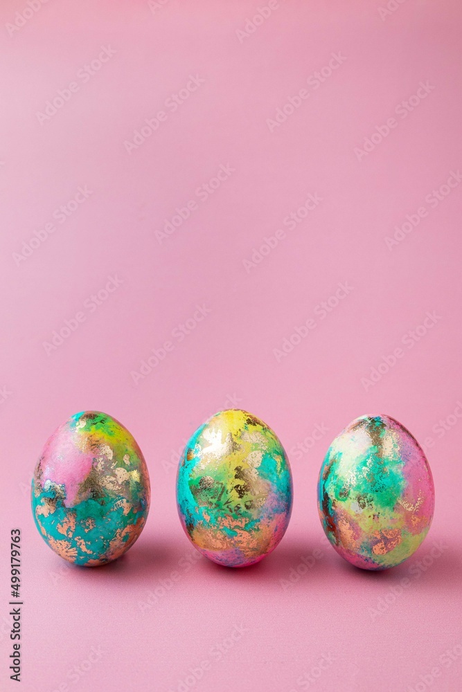 Easter colorful eggs on pink background. Easter card. Copy space for text. Selective focus. Easter colorful eggs on pink background. Easter card. Copy space for text. Selective focus.