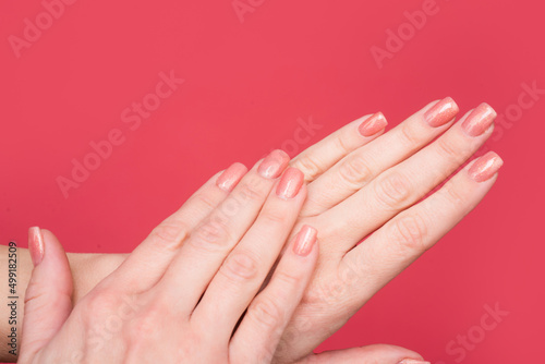 closeup of female hands with manicure and smooth skin