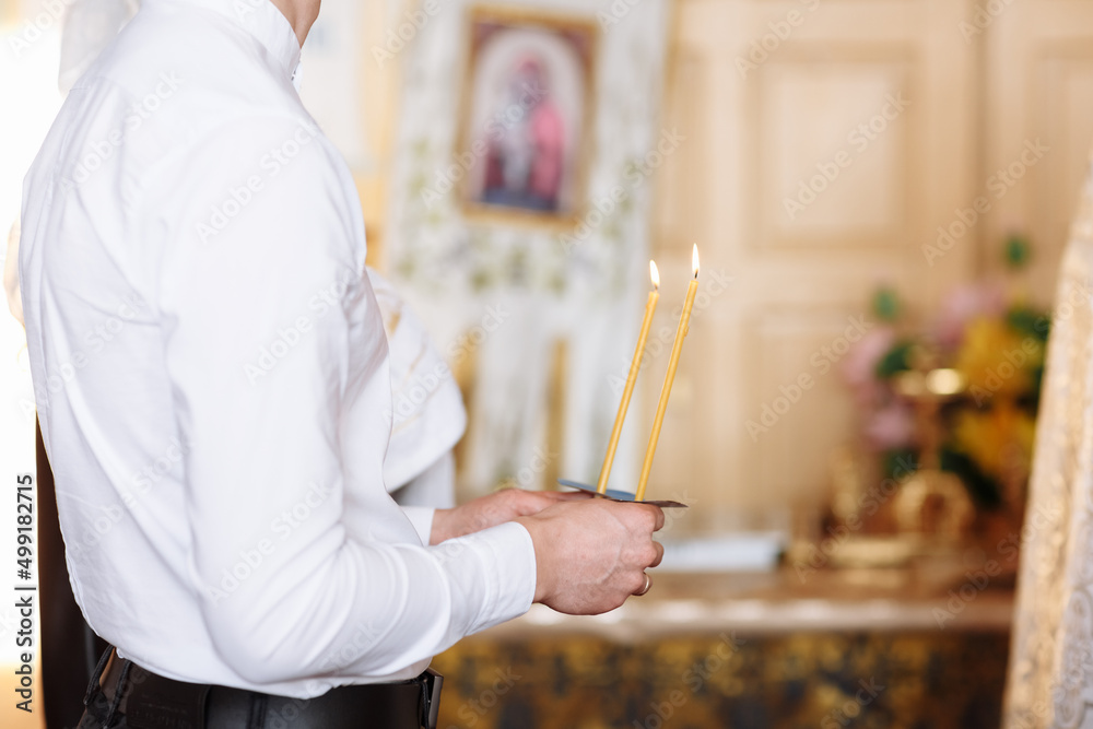 Obraz premium keep a lighted candle in the church. pray for peace