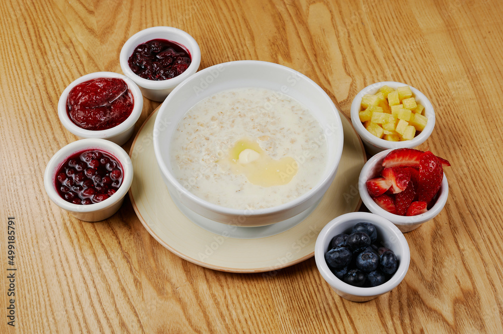 oatmeal for breakfast with berries and fruits oatmeal for breakfast with berries and fruits