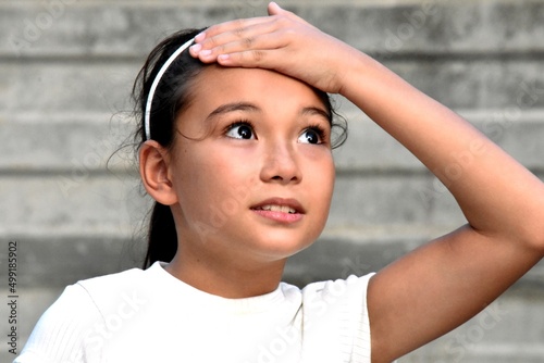 Fotografi Bewildered Or Forgetful Asian Girl Child