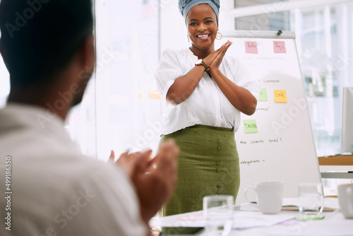 That was a great presentation. Shot of businesspeople having a meeting in a boardroom at work.