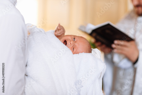 baptism of a child in the church. Ukrainian Orthodox Church. Orthodox baptism of a child. Church rite of acceptance of faith.