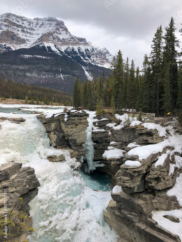 Frozen waterfall in Canadian rocky mountains during winter
