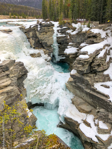Frozen waterfall in Canadian rocky mountains during winter